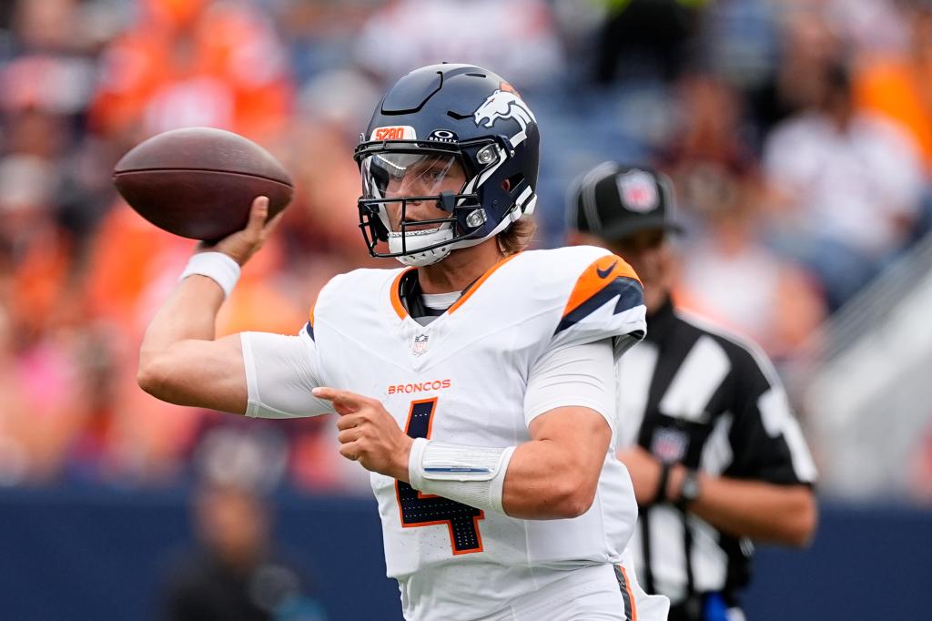 Denver Broncos quarterback Zach Wilson throws against the Arizona Cardinals during the second half of a preseason NFL football game Sunday, August. 25, 2024, in Denver.  