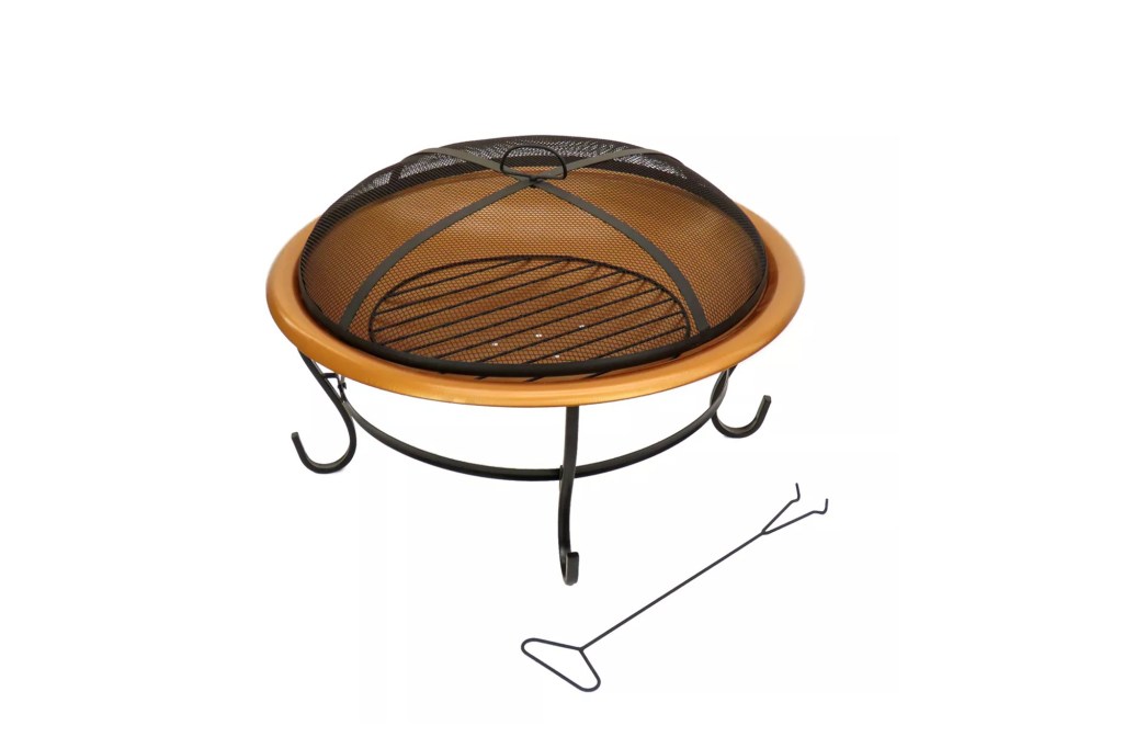 A round fire pit with a mesh cover