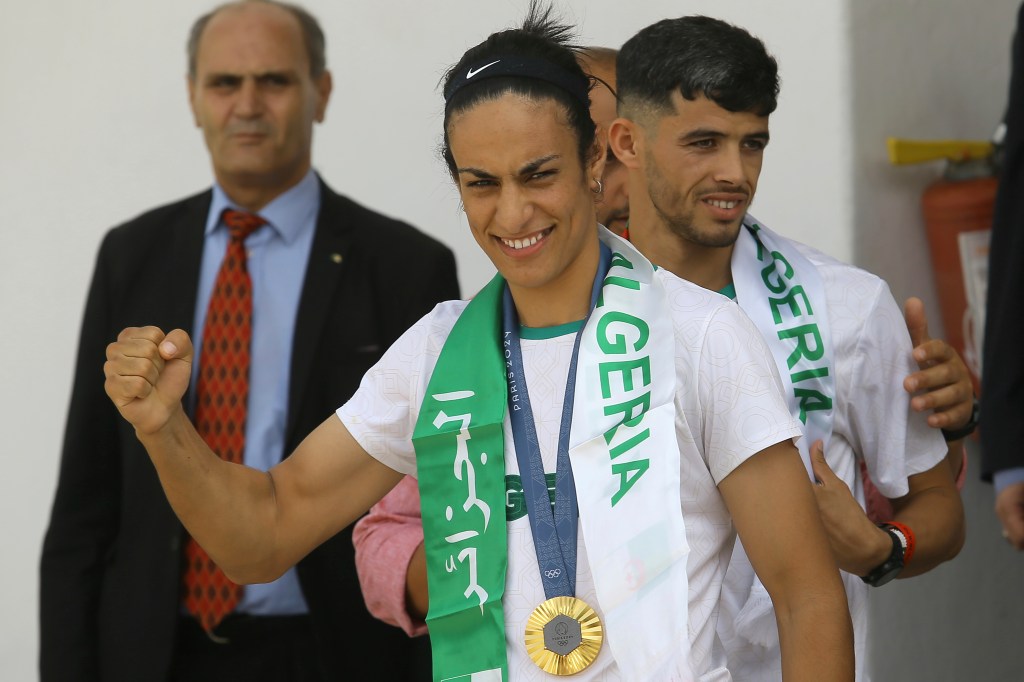 Gold medalist in the the women's 66 kg boxing Algeria's Imane Khelif, left, and bronze medalist in the men's 800m Djamel Sedjati arrive after the 2024 Summer Olympics