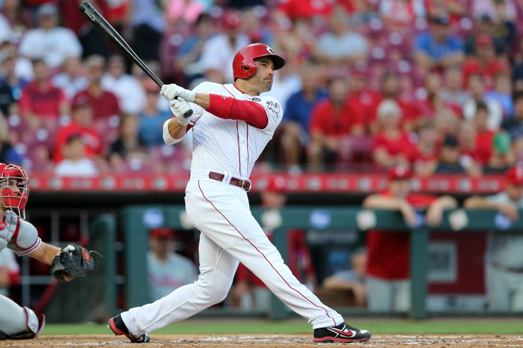 Reds first baseman Joey Votto (19) hits a double in the second inning of an MLB baseball game against the Philadelphia Phillies, Wednesday, Sept. 4, 2019, at Great American Ball Park in Cincinnati.