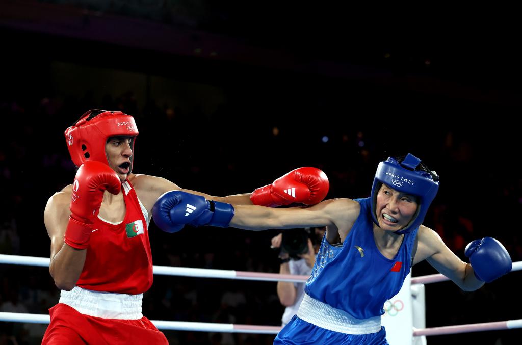 Imane Khelif of Team Algeria and Liu Yang of Team People's Republic of China exchange punches during the Boxing Women's 66kg Final match