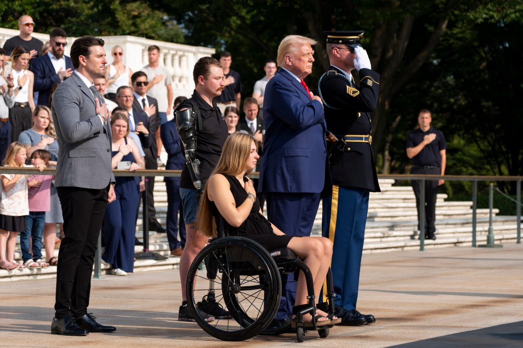 Former President Donald Trump and veterans Marlon Bateman, Tyler Vargas, and Kelsee Lainhart placing a wreath at the Tomb of the Unknown Soldier in honor of fallen service members.