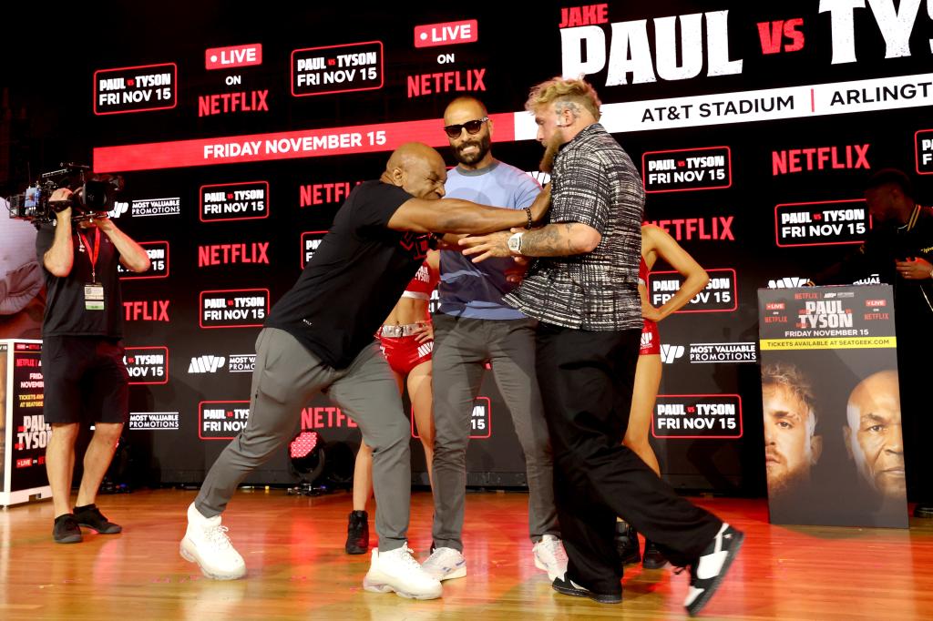 Mike Tyson and Jake Paul face off at an exclusive press conference ahead of their November bout during the Fanatics Fest NYC 2024 at Jacob Javits Center on August 18, 2024 in New York City. 