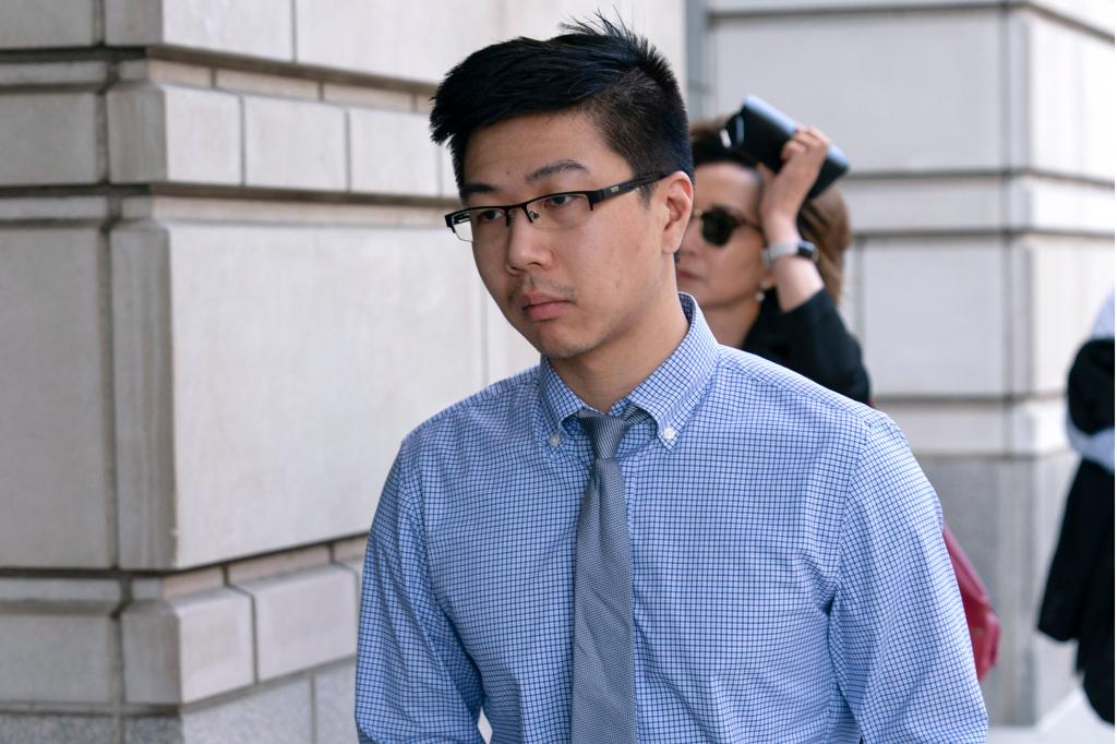 Montgomery County police officer Justin Lee in a blue shirt and tie arriving at the U.S. Federal Courthouse in Washington on Aug. 23, 2024