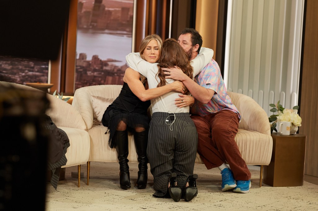 Jennifer Aniston, Drew Barrymore and Adam Sandler hug on "The Drew Barrymore Show."