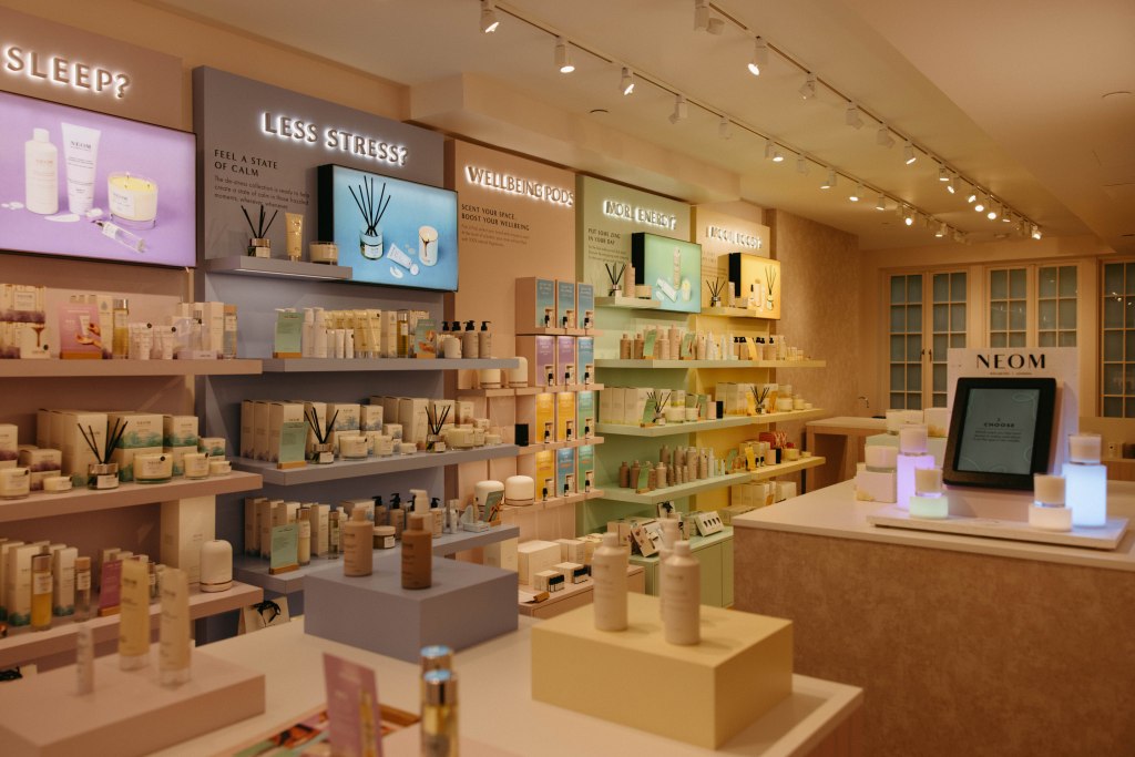 A store with shelves of products at the NEOM NYC store for ALEXA calendar August 2 event