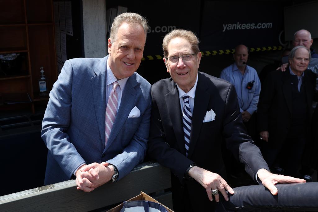 Michael Kay and John Sterling pose for a photo before the game against the Tampa Bay Rays at Yankee Stadium on April 20, 2024, in New York, New York. 