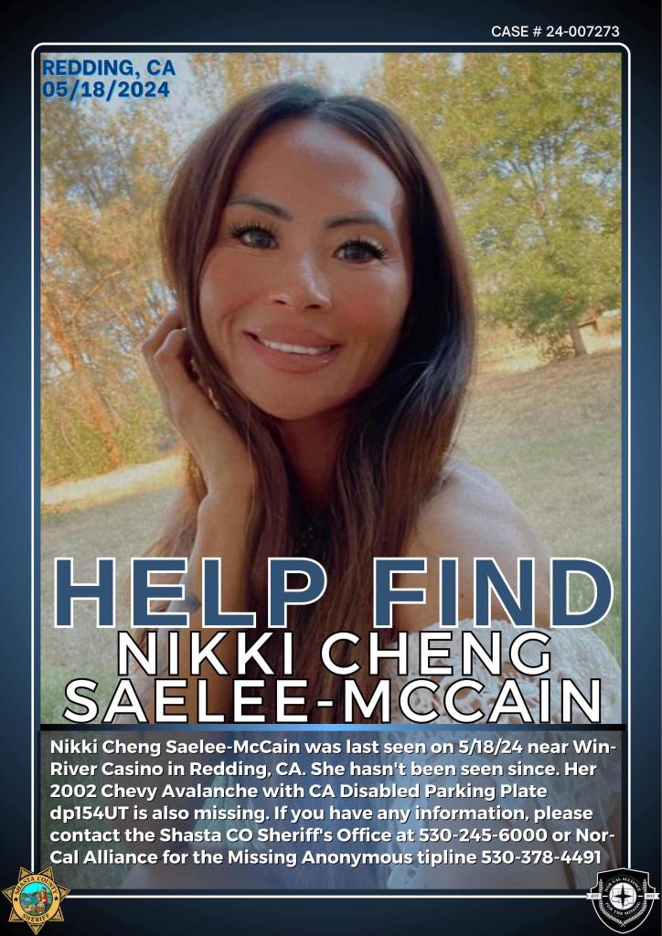 Nikki Cheng Saelee-McCain smiling with her hand to her face