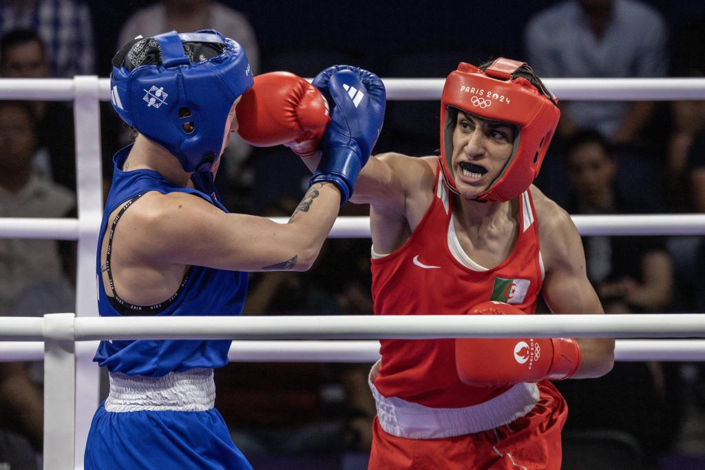 Imane Khelif (R.) punches  Luca Anna Hamori during their Olympic quarterfinal match on Aug. 3, 2024.  