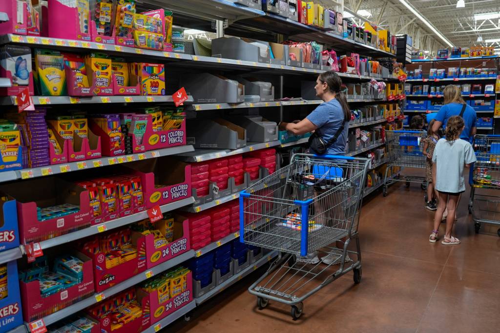 People shopping for school supplies inside a Walmart in Edmond, Oklahoma.