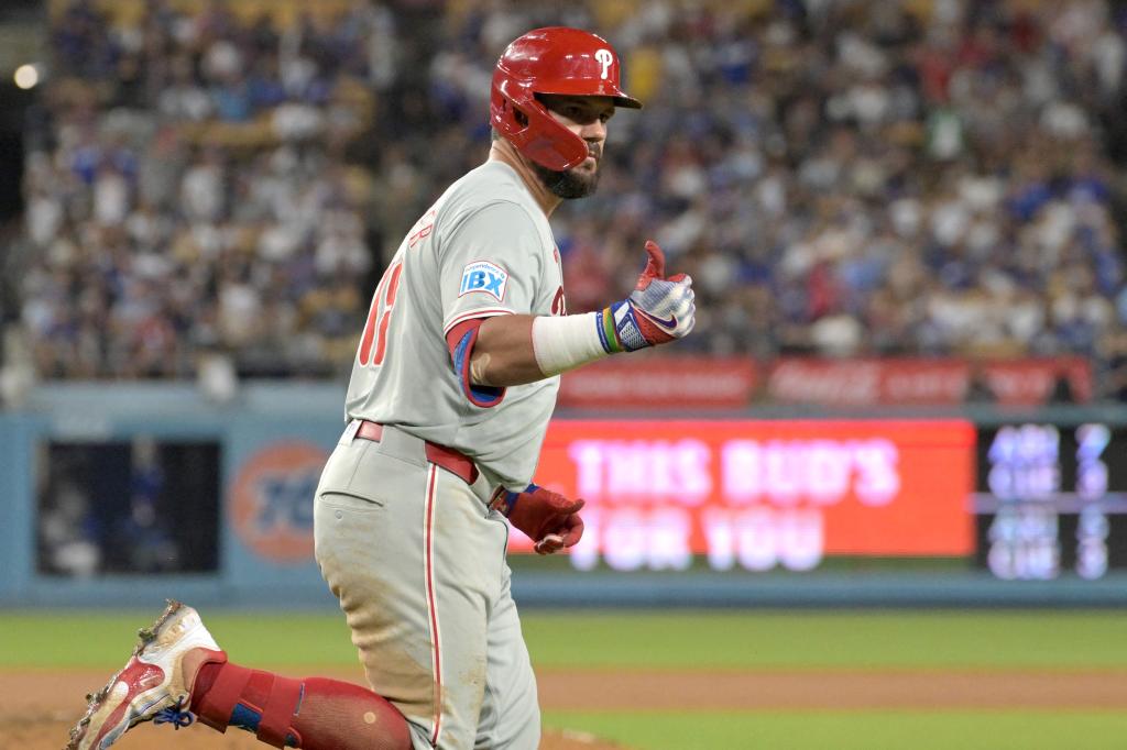 Philadelphia Phillies designated hitter Kyle Schwarber (12) rounds the bases after a three-run home run in the sixth inning against the Los Angeles Dodgers at Dodger Stadium.