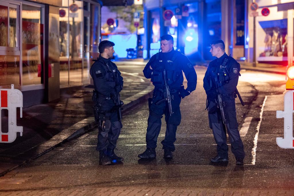 Police and deployed near the scene where people were killed and injured in an attack at a festival in Solingen.