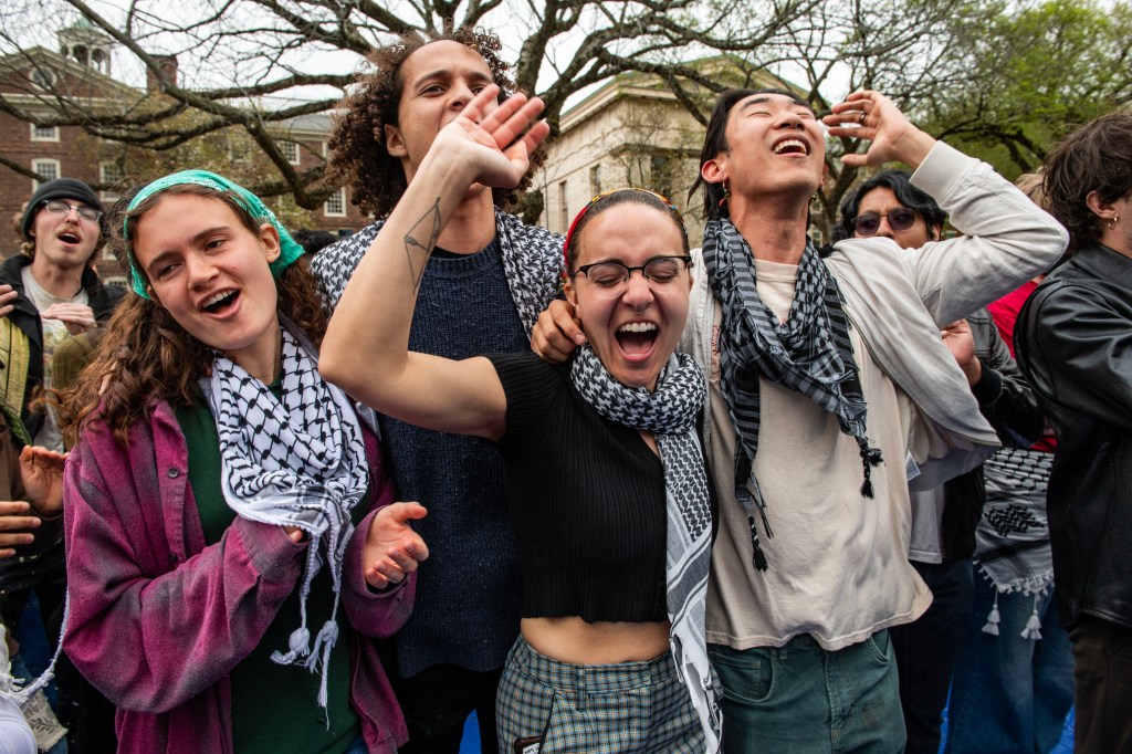 Pro-Palestinian students celebrating at Brown University after reaching a deal with the administration