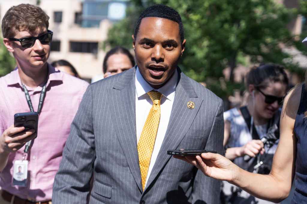 Rep. Ritchie Torres, D-N.Y., in a suit, speaking to reporters after a House Democratic Caucus meeting about President Joe Biden's candidacy, 2024