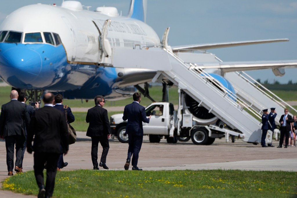 Republican vice presidential nominee JD Vance walking towards Air Force Two at Chippewa Valley Regional Airport