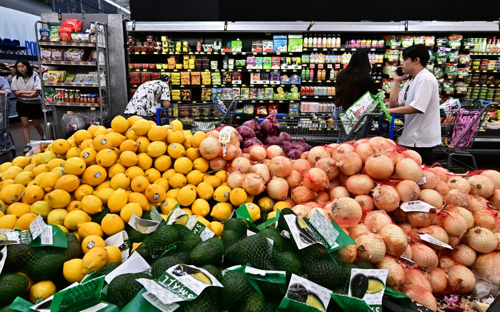 People shop at a grocery store.