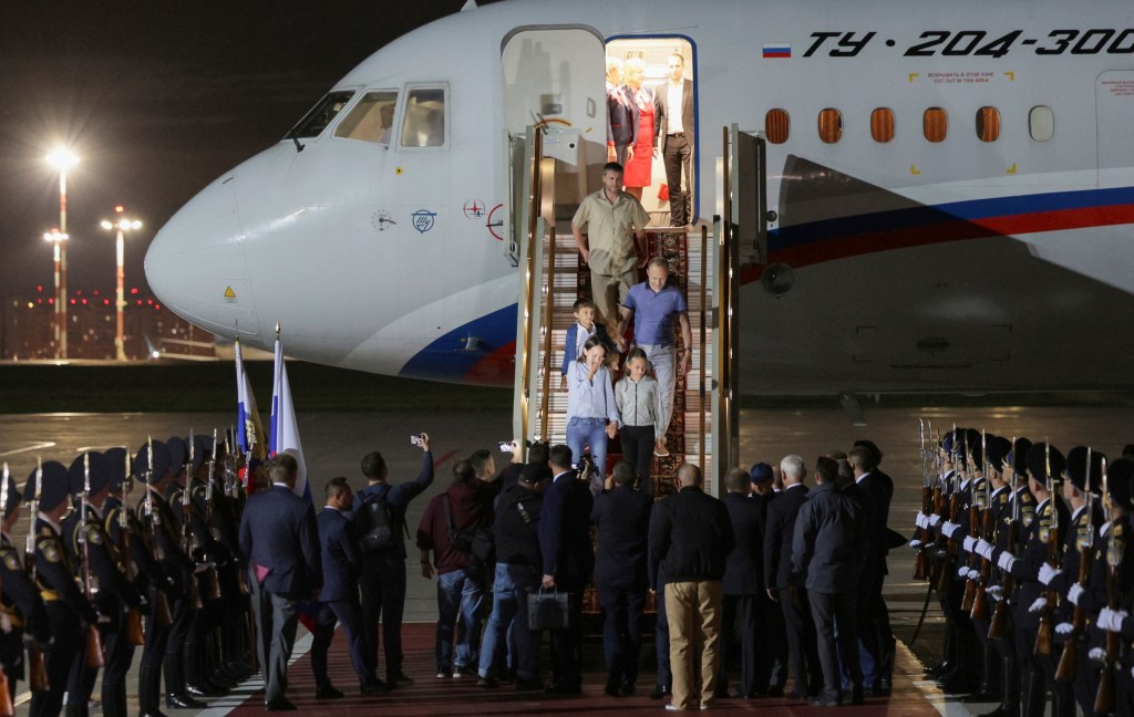 Russian President Vladimir Putin, greets released Russian prisoners upon their arrival at the Vnukovo government airport outside Moscow, Russia, on Thursday, Aug. 1, 2024.