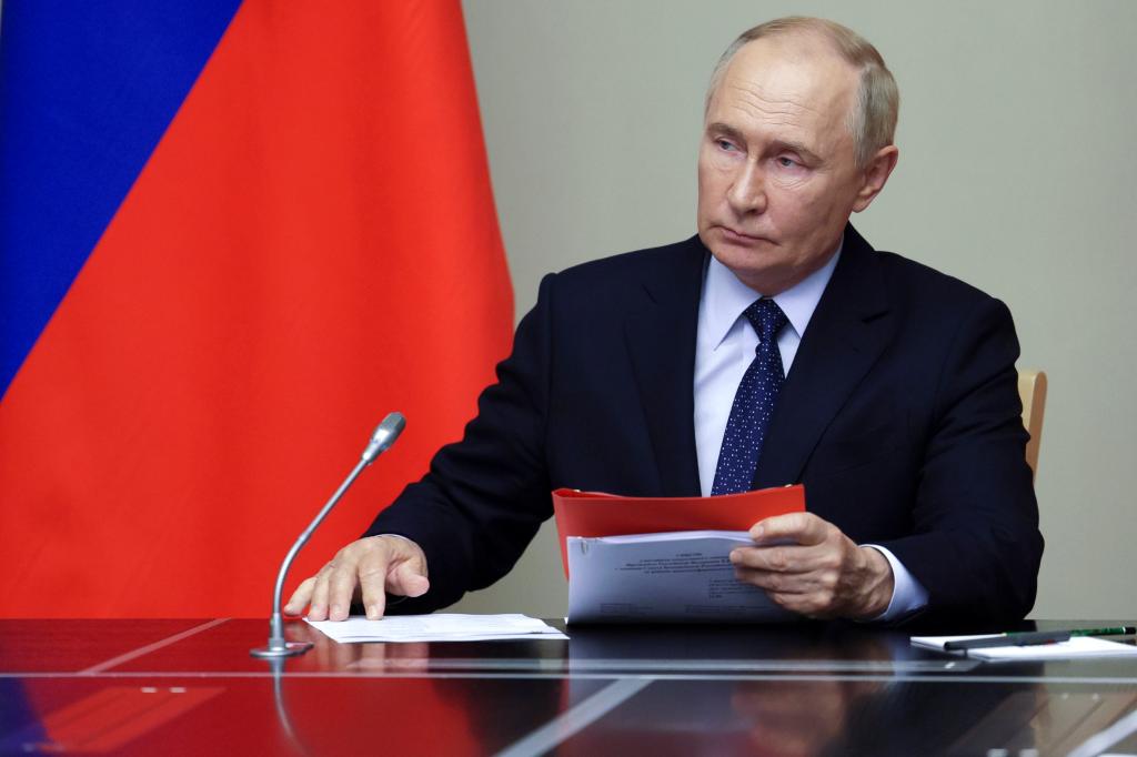 Russian President Vladimir Putin leads a meeting with Russian Security Council's members at the Novo-Ogaryovo state residence, outside Moscow, Russia, Friday, Aug. 9, 2024. 