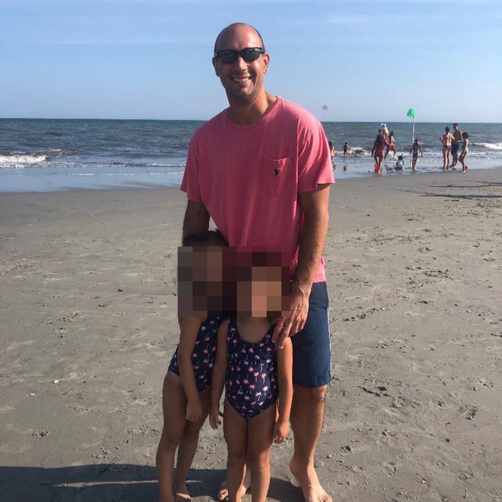 Decorated army major Sean Higgins with his family at the beach