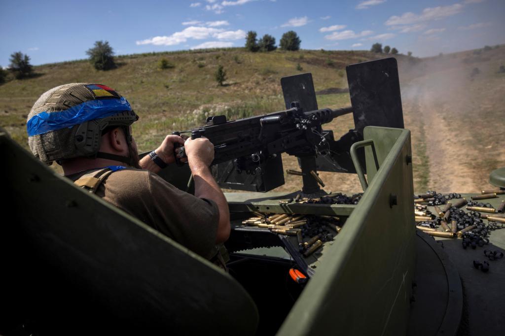 A soldier fires a gun.