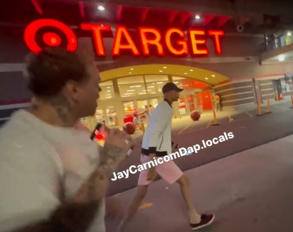 A picture of William C.C. Kemp-Neal being approached outside the Target store.