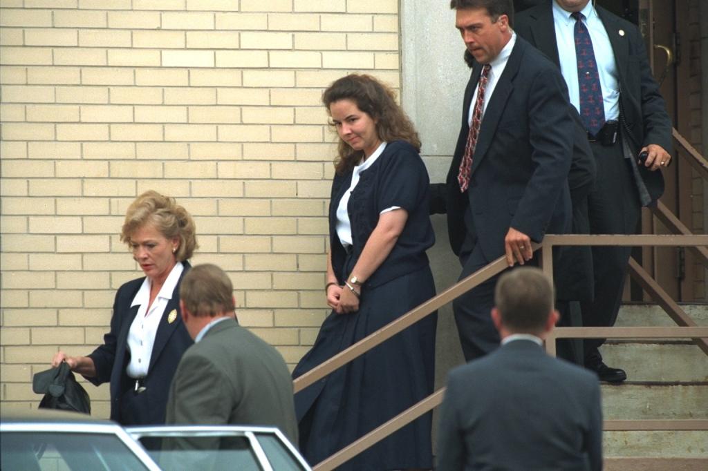 A file photo showing Smith being led away from court in 1994.