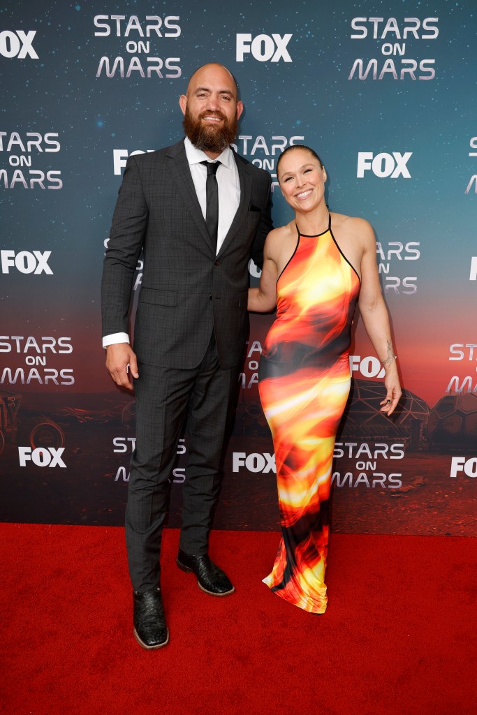 Travis Browne and Ronda Rousey attend FOX's Stars On Mars "The Mars Bar" VIP red carpet press preview at Scum and Villainy Cantina on June 01, 2023 in Hollywood, California. 