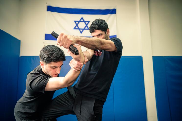 Tsahi Shemesh (right) spars with Eliran Meimis at Krav Maga Experts