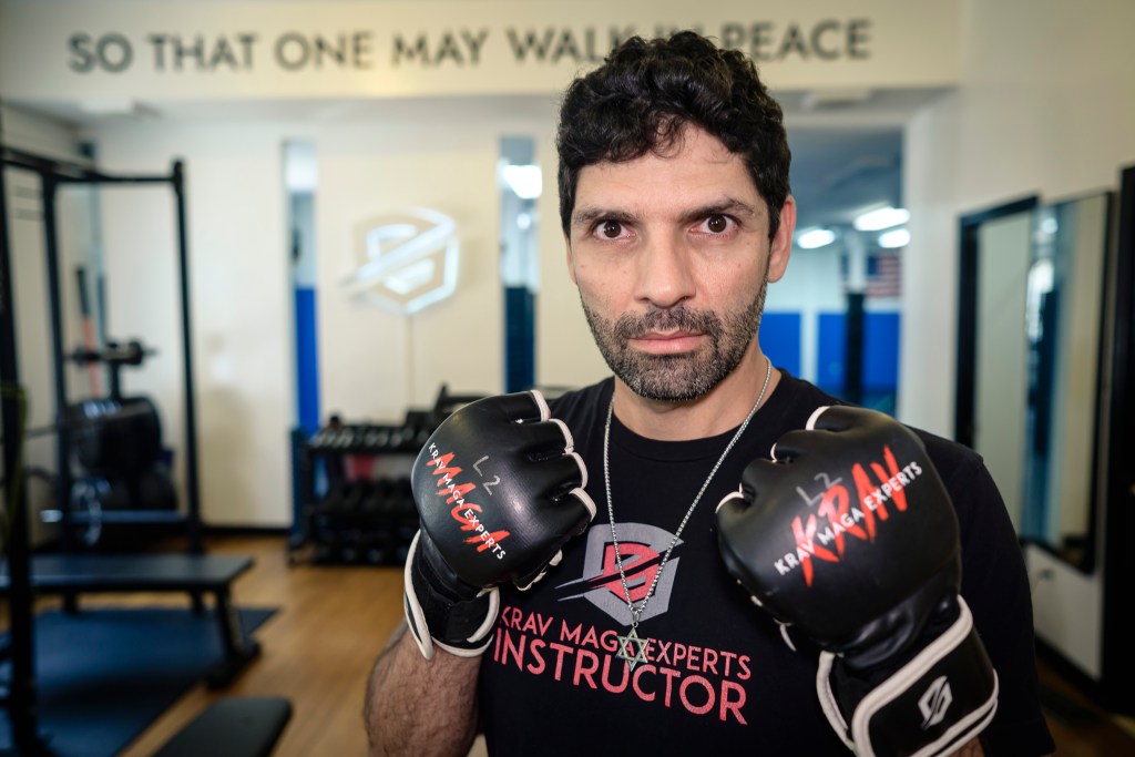 Tsahi Shemesh with gloved fists up at Krav Maga Experts. 