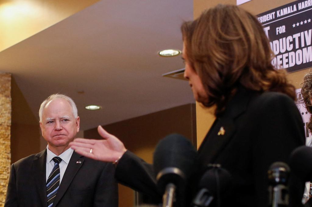 Vice President Kamala Harris speaks next to Minnesota Governor Tim Walz during a visit to the St. Paul Health Center, a clinic that performs abortions, in St. Paul, Minnesota, U.S., March 14, 2024. 