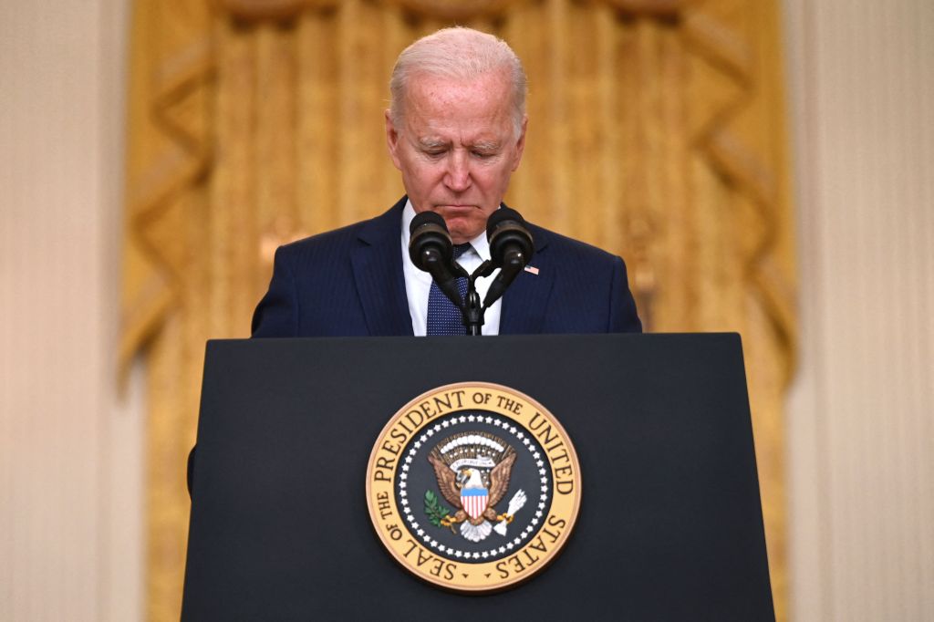 President Joe Biden pauses as he delivers remarks on the terror attack at Hamid Karzai International Airport, and the US service members and Afghan victims killed and wounded, in the East Room of the White House, Washington, DC on August 26, 2021.