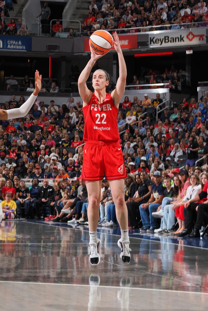 Caitlin Clark #22 of the Indiana Fever shoots a three point basket during the game on August 16, 2024 at Gainbridge Fieldhouse in Indianapolis, Indiana.  