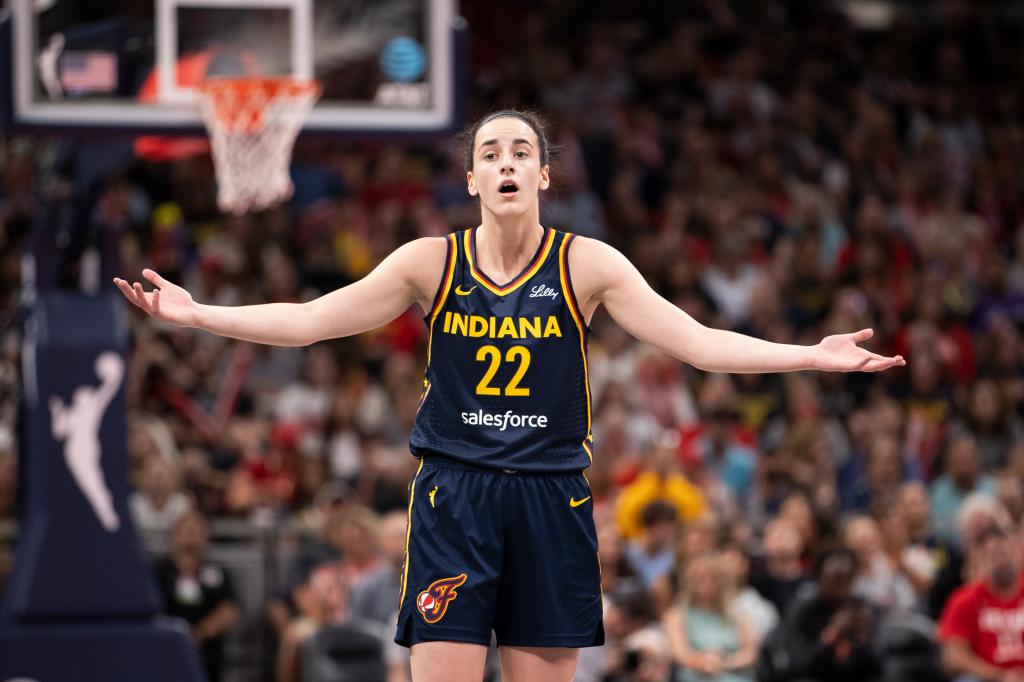 Caitlin Clark #22 of the Indiana Fever reacts to a foul called in the first half of the game against the Seattle Storm at Gainbridge Fieldhouse on August 18, 2024 in Indianapolis, Indiana.  