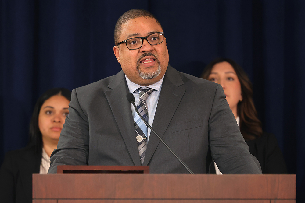 Manhattan District Attorney Alvin Bragg announces charges against restaurant owner at a press conference