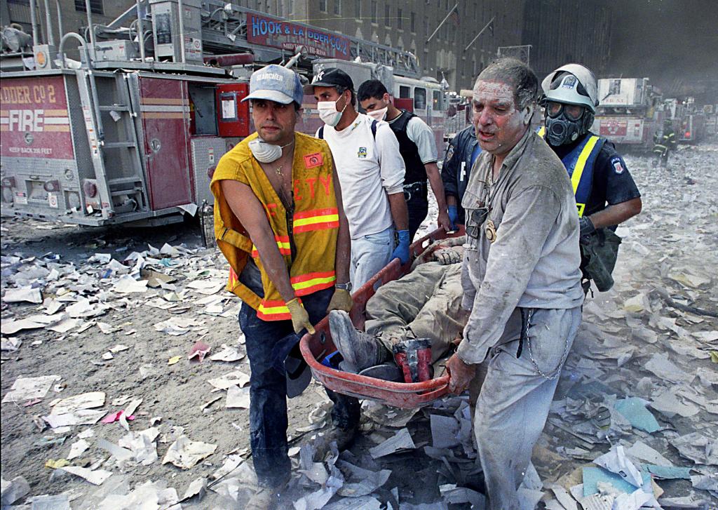 A victim is pulled out of the rubble at Ground Zero on 9/11.