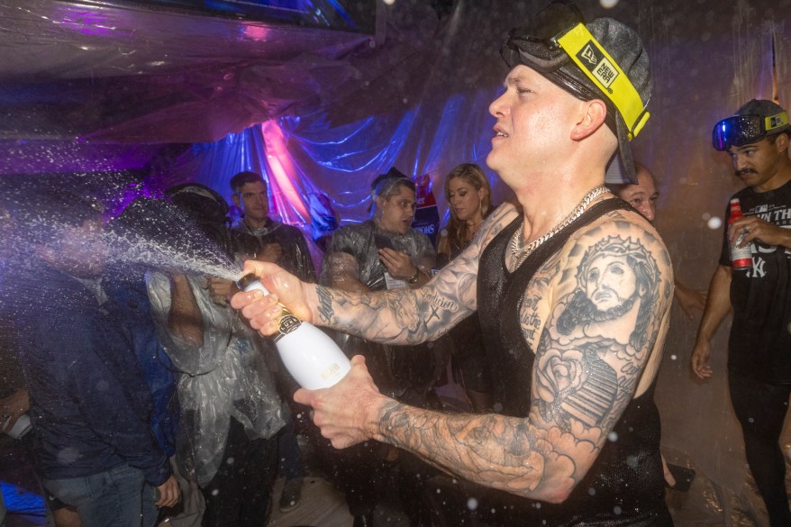 New York Yankees left fielder Alex Verdugo #24 celebrates in the clubhouse after defeating the Baltimore Orioles.