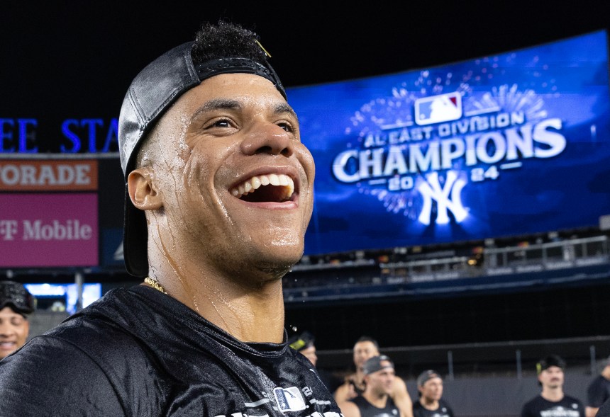 New York Yankees right fielder Juan Soto #22 celebrates on the field after defeating the Baltimore Orioles to clench and become the AL East Division Champions.