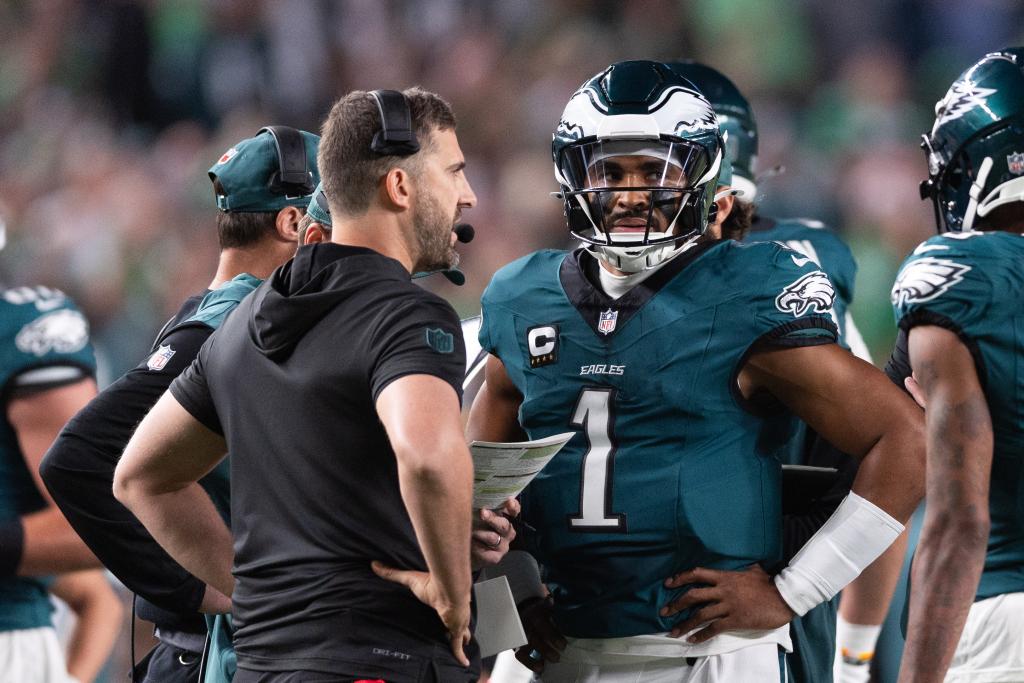 Philadelphia Eagles quarterback Jalen Hurts (1) talks with head coach Nick Sirianni during a timeout in the first quarter against the Atlanta Falcons at Lincoln Financial Field. 