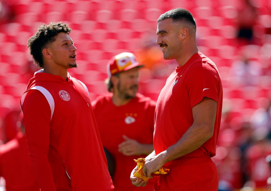 Patrick Mahomes #15 of the Kansas City Chiefs and Travis Kelce #87 of the Kansas City Chiefs warms up prior to a game against the Chicago Bears