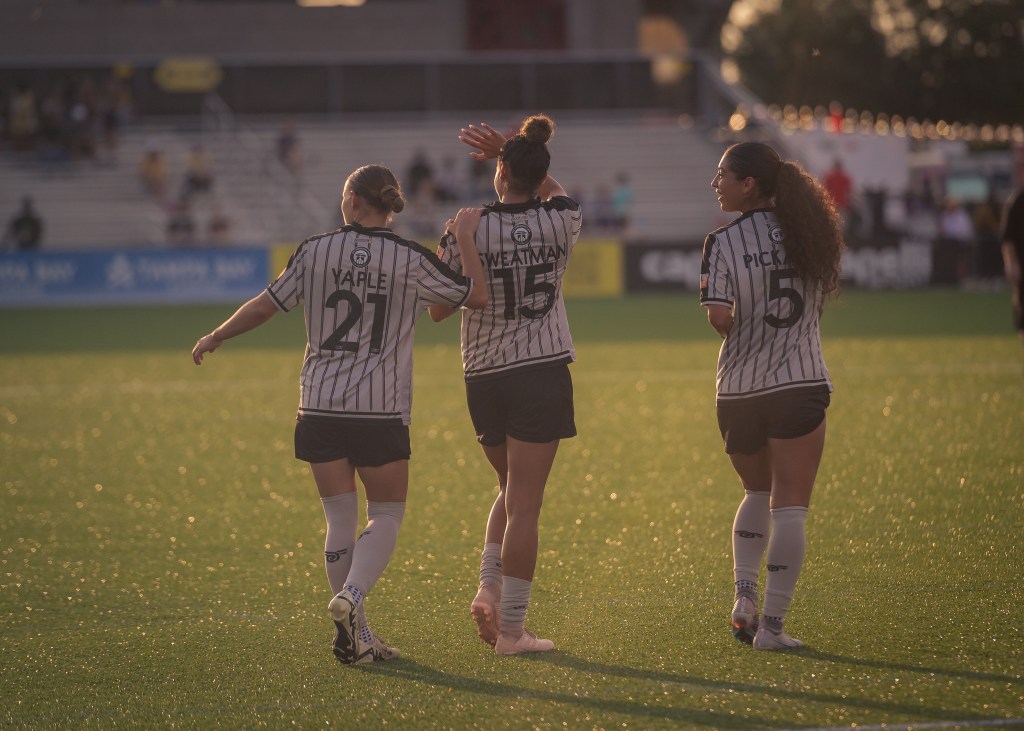 Emily Yaple (21), Marlo Sweatman (15) and Sasha Pickard (5) in action for Brooklyn FC women's team.
