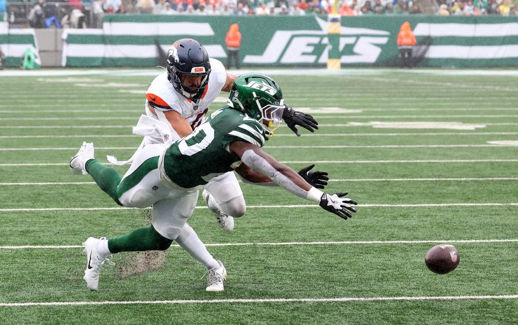 New York Jets running back Breece Hall (20) fails to hold onto the ball during the first half when the New York Jets played the Denver Broncos Sunday, September 29, 2024 at MetLife Stadium in East Rutherford, NJ. 