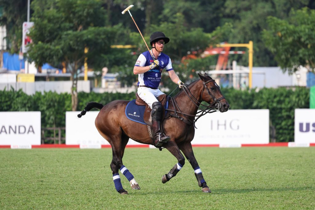 Prince Harry playing polo during the Sentebale ISPS Handa Polo Cup in Singapore, helping raise funds for children and young people in southern Africa