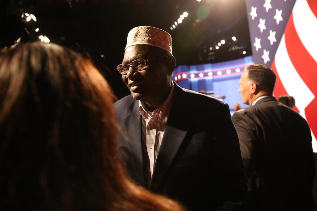 Malik Obama, Kenyan-born half-brother of U.S. President Barack Obama, speaks to attendees after the third U.S. presidential debate in Las Vegas, Nevada, U.S., on Wednesday, Oct. 19, 2016.