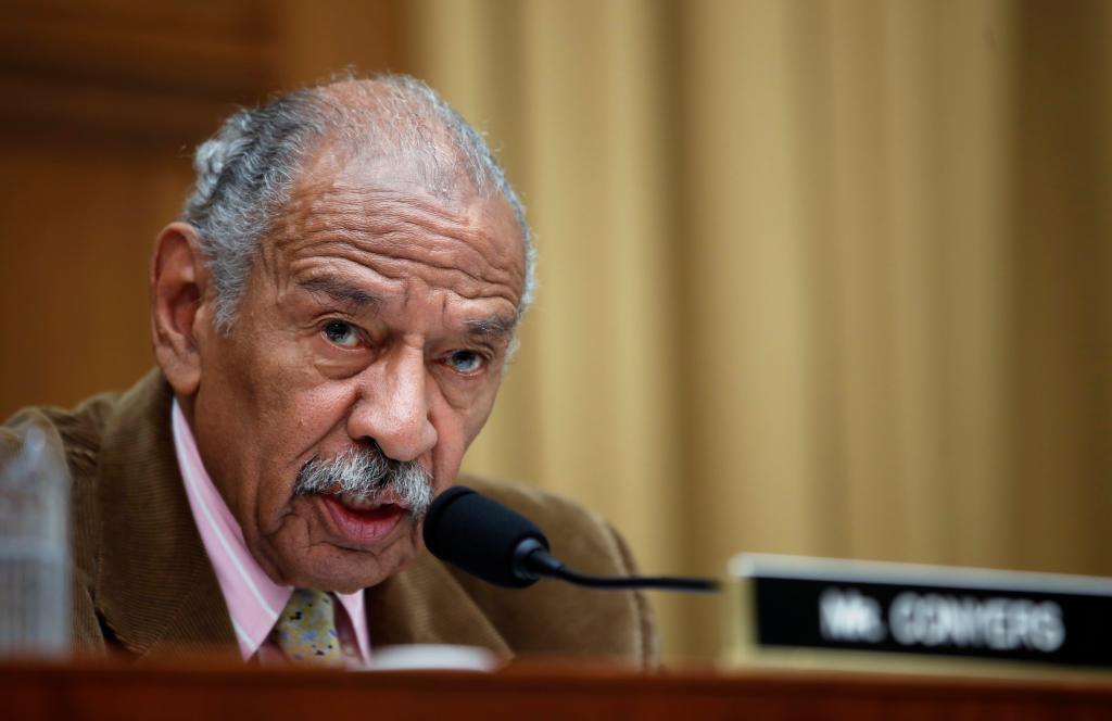 Rep. John Conyers, D-Mich., speaking into a microphone during a House Judiciary subcommittee hearing on Capitol Hill, April 4, 2017