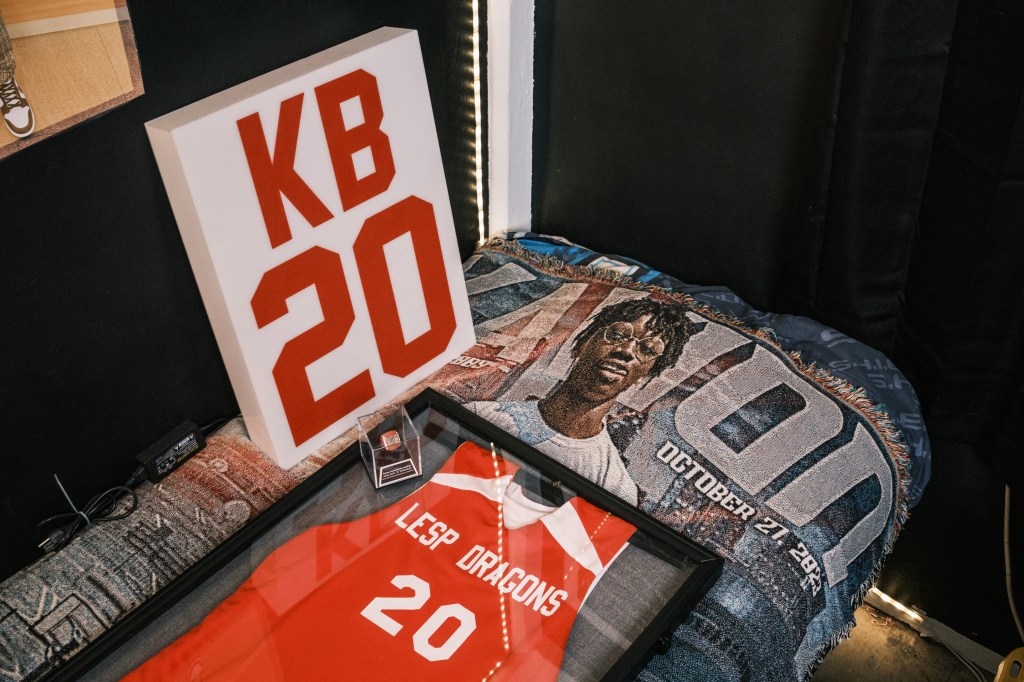 Mementos of Kavion Brown Godfrey including a sports jersey. 