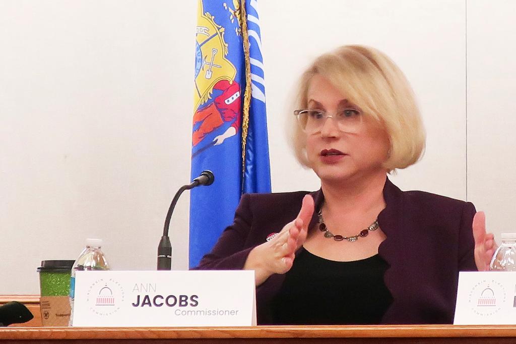 Democrat Ann Jacobs sitting at a podium during a Wisconsin Elections Commission meeting in Madison