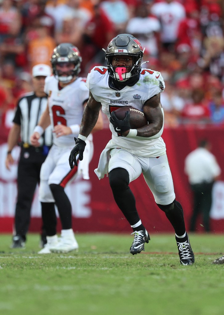 Tampa Bay Buccaneers running back Bucky Irving (7) runs with the ball against the Washington Commanders during the second half at Raymond James Stadium. 