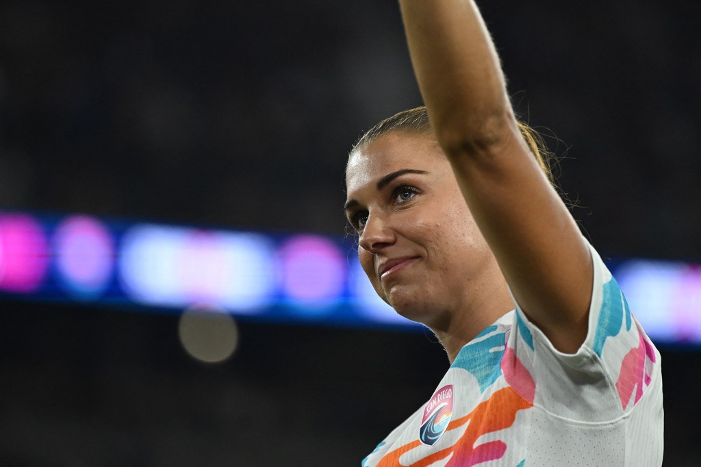 San Diego Wave forward Alex Morgan waves to fans following her final match before retirement.