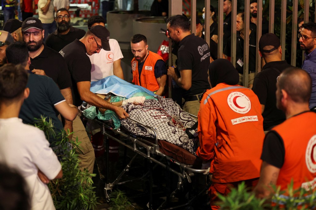 A person is carried on a stretcher outside American University of Beirut Medical Center (AUBMC) as people, including Hezbollah fighters and medics, were wounded and killed when the pagers they use to communicate exploded across Lebanon, according to a security source, in Beirut, Lebanon September 17, 2024.