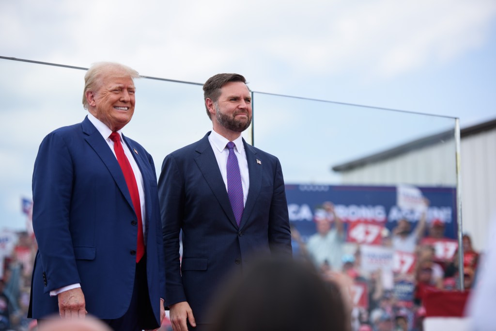 Republican Presidential candidate, former U.S. president, Donald Trump, left, poses for photos with Republican Vice Presidential candidate, U.S. Sen. J.D. Vance, (R-OH), before making remarks to a crowd during an event on August 21, 2024 in Asheboro, North Carolina